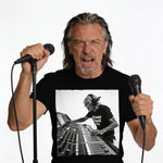 Man wearing black t-shirt with graphic of goblin at soundboard.