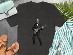 Abraham Lincoln in a tuxedo plays electric guitar on a dark t-shirt.