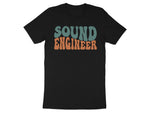 Black t-shirt with retro "SOUND ENGINEER" text in orange and teal.